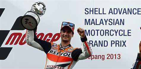 Honda MotoGP rider Dani Pedrosa of Spain celebrates after winning the Malaysian Motorcycle Grand Prix in Sepang October 13, 2013. REUTERS/Sa Honda MotoGP rider Dani Pedrosa of Spain celebrates after winning the Malaysian Motorcycle Grand Prix in Sepang October 13, 2013. REUTERS/Sa