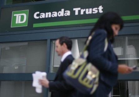 People walk past a Toronto Dominion Bank branch in Ottawa August 27, 2009. REUTERS/Chris Wattie People walk past a Toronto Dominion Bank branch in Ottawa August 27, 2009. REUTERS/Chris Wattie