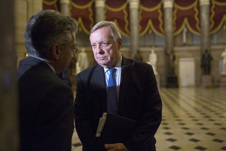 Nadeam Elshami, (L) chief of staff to House Minority Leader Nancy Pelosi (D-CA), speaks with U.S. Senator Dick Durbin (D-IL) after a late-ni Nadeam Elshami, (L) chief of staff to House Minority Leader Nancy Pelosi (D-CA), speaks with U.S. Senator Dick Durbin (D-IL) after a late-ni