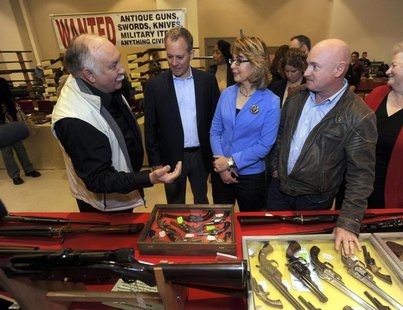 Show organizer Dave Petronis (L) leads (2nd L-R) New York Attorney General Eric Schneiderman, former U.S. Rep. Gabrielle Giffords, and her h Show organizer Dave Petronis (L) leads (2nd L-R) New York Attorney General Eric Schneiderman, former U.S. Rep. Gabrielle Giffords, and her h