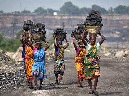 Local women carry coal taken from open cast coal field at Dhanbad district in the eastern Indian state of Jharkhand in this September 19, 20 Local women carry coal taken from open cast coal field at Dhanbad district in the eastern Indian state of Jharkhand in this September 19, 20
