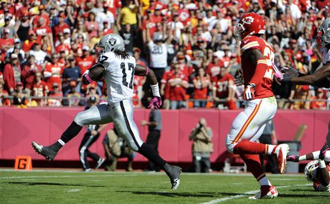 Oct 13, 2013; Kansas City, MO, USA; Oakland Raiders wide receiver Denarius Moore (17) scores a touchdown against the Kansas City Chiefs in t Oct 13, 2013; Kansas City, MO, USA; Oakland Raiders wide receiver Denarius Moore (17) scores a touchdown against the Kansas City Chiefs in t