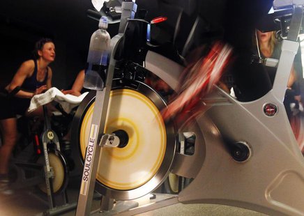 The wheels of an indoor bicycle are seen spinning at a SoulCycle class at their Union Square location in New York April 13, 2011. RREUTERS/S The wheels of an indoor bicycle are seen spinning at a SoulCycle class at their Union Square location in New York April 13, 2011. RREUTERS/S