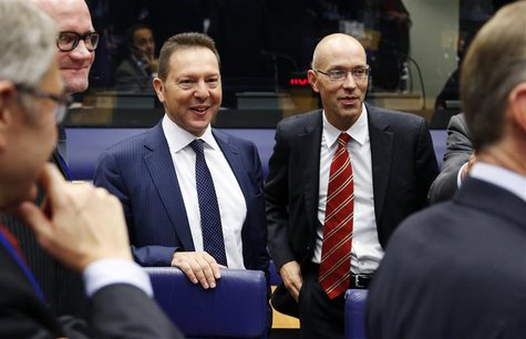 Greece's Finance Minister Yannis Stournaras and Executive Board Member of the European Central Bank (ECB) Jorg Asmussen (R) attend a eurozon Greece's Finance Minister Yannis Stournaras and Executive Board Member of the European Central Bank (ECB) Jorg Asmussen (R) attend a eurozon