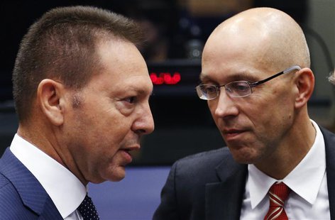 Greece's Finance Minister Yannis Stournaras talks to Executive Board Member of the European Central Bank (ECB) Jorg Asmussen (R) during a eu Greece's Finance Minister Yannis Stournaras talks to Executive Board Member of the European Central Bank (ECB) Jorg Asmussen (R) during a eu