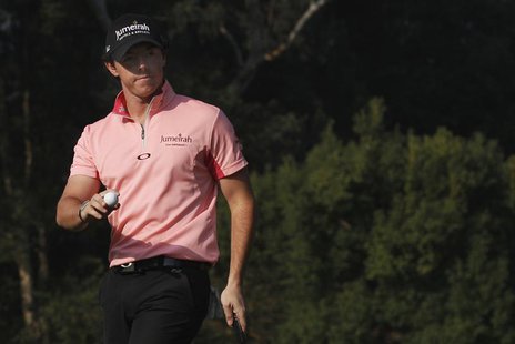 Rory Mcilroy of Northern Ireland reacts after putting on the 14th green during the second day of the Hong Kong Open golf tournament at the H Rory Mcilroy of Northern Ireland reacts after putting on the 14th green during the second day of the Hong Kong Open golf tournament at the H