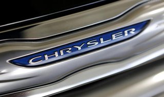 The Chrysler logo is shown on a new Chrysler 200 on the showroom at the Massey-Yardley Chrysler, Dodge, Jeep and Ram automobile dealership i The Chrysler logo is shown on a new Chrysler 200 on the showroom at the Massey-Yardley Chrysler, Dodge, Jeep and Ram automobile dealership i