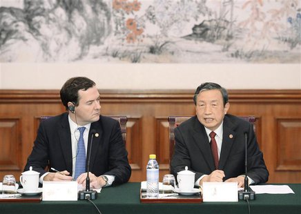 Chinese Vice Premier Ma Kai (R) talks with Britain's Chancellor of the Exchequer George Osborne during a meeting at the Diaoyutai Guesthouse Chinese Vice Premier Ma Kai (R) talks with Britain's Chancellor of the Exchequer George Osborne during a meeting at the Diaoyutai Guesthouse
