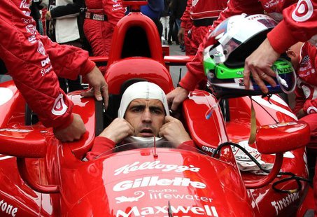 Target Chip Ganassi Racing driver Dario Franchitti of Britain dons his headgear ahead of the 97th running of the Indianapolis 500 at the Ind Target Chip Ganassi Racing driver Dario Franchitti of Britain dons his headgear ahead of the 97th running of the Indianapolis 500 at the Ind