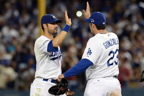 October 14, 2013; Los Angeles, CA, USA; Los Angeles Dodgers center fielder Andre Ethier (16) and first baseman Adrian Gonzalez (23) celebrat October 14, 2013; Los Angeles, CA, USA; Los Angeles Dodgers center fielder Andre Ethier (16) and first baseman Adrian Gonzalez (23) celebrat