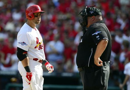 Oct 4, 2013; St. Louis, MO, USA; St. Louis Cardinals right fielder Carlos Beltran (left) argues with home plate umpire Wally Bell (right) af Oct 4, 2013; St. Louis, MO, USA; St. Louis Cardinals right fielder Carlos Beltran (left) argues with home plate umpire Wally Bell (right) af