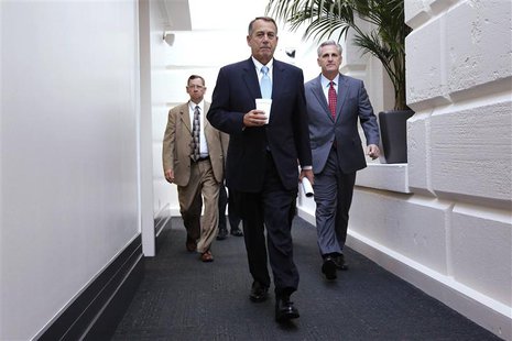 House Speaker John Boehner (R-OH) (C) and House Majority Whip Rep. Kevin McCarthy (R-CA) (R) arrive for a Republican caucus meeting at the U House Speaker John Boehner (R-OH) (C) and House Majority Whip Rep. Kevin McCarthy (R-CA) (R) arrive for a Republican caucus meeting at the U