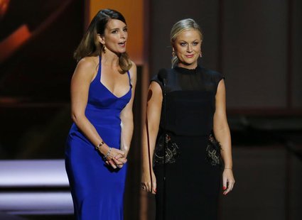 Actresses Tina Fey (L) and Amy Poehler present the award for Outstanding Supporting Actress In A Comedy Series at the 65th Primetime Emmy Aw Actresses Tina Fey (L) and Amy Poehler present the award for Outstanding Supporting Actress In A Comedy Series at the 65th Primetime Emmy Aw