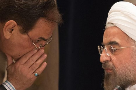 A member of Iran's delegation speaks to Iran's President Hassan Rouhani (R) before a news conference in New York September 27, 2013. REUTERS A member of Iran's delegation speaks to Iran's President Hassan Rouhani (R) before a news conference in New York September 27, 2013. REUTERS