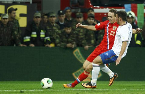 Azerbaijan's Qara Qarayev (R) fights for the ball with Russia's Aleksei Kozlov during their 2014 World Cup qualifying soccer match in Baku, Azerbaijan's Qara Qarayev (R) fights for the ball with Russia's Aleksei Kozlov during their 2014 World Cup qualifying soccer match in Baku,