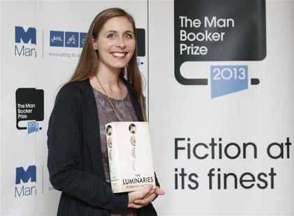 Man Booker prize shortlist nominee Eleanor Catton poses with her book "The Luminaries" during a photocall at the Southbank Centre in London, Man Booker prize shortlist nominee Eleanor Catton poses with her book "The Luminaries" during a photocall at the Southbank Centre in London,