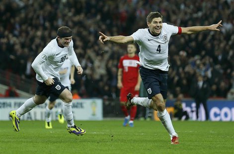 England captain Steven Gerrard (R) celebrates his goal with teammate Wayne Rooney during their 2014 World Cup qualifying soccer match agains England captain Steven Gerrard (R) celebrates his goal with teammate Wayne Rooney during their 2014 World Cup qualifying soccer match agains