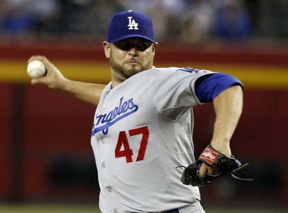 Los Angeles Dodgers pitcher Ricky Nolasco delivers a pitch against the Arizona Diamondbacks during the second inning of their MLB game in Ph Los Angeles Dodgers pitcher Ricky Nolasco delivers a pitch against the Arizona Diamondbacks during the second inning of their MLB game in Ph