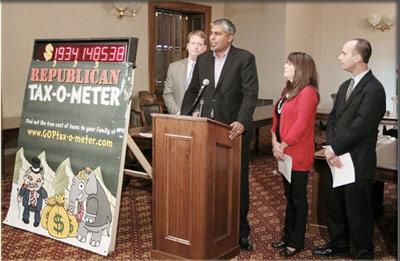 House democrats introduce the Taz-o-meter at a news conference in the State Capitol. House democrats introduce the Taz-o-meter at a news conference in the State Capitol.