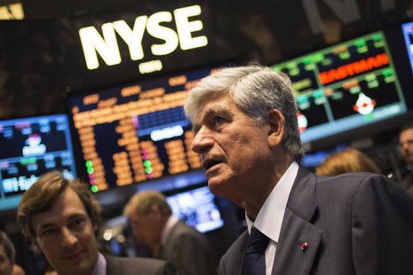 Publicis Group Chairman and CEO Maurice Levy (R) watches a stock ticker after announcing an agreement on their merger on the floor of the Ne Publicis Group Chairman and CEO Maurice Levy (R) watches a stock ticker after announcing an agreement on their merger on the floor of the Ne