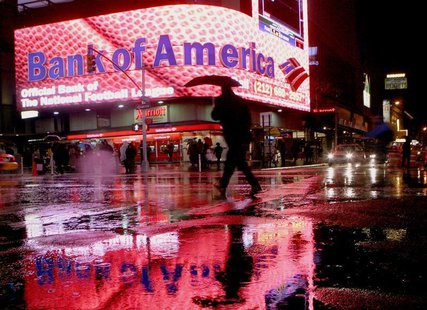 A man walks near a Bank of America branch in New York's Times Square Decemeber 11, 2008. REUTERS/Brendan McDermid A man walks near a Bank of America branch in New York's Times Square Decemeber 11, 2008. REUTERS/Brendan McDermid