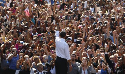 U.S. President Barack Obama waves to the crowd as he walks onstage for a campaign rally in Richmond, Virginia October 25, 2012. REUTERS/Kevi U.S. President Barack Obama waves to the crowd as he walks onstage for a campaign rally in Richmond, Virginia October 25, 2012. REUTERS/Kevi