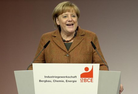 German Chancellor Angela Merkel (CDU) laughs as she delivers her speech at a congress of the Industrial Mining, Chemistry, Energy Union (IG German Chancellor Angela Merkel (CDU) laughs as she delivers her speech at a congress of the Industrial Mining, Chemistry, Energy Union (IG