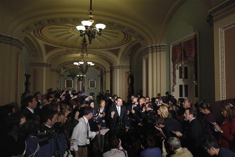 Reporters gather around U.S. Senator Ted Cruz (R-TX) as he announces he will not filibuster, after a Republican Senate caucus meeting at the Reporters gather around U.S. Senator Ted Cruz (R-TX) as he announces he will not filibuster, after a Republican Senate caucus meeting at the