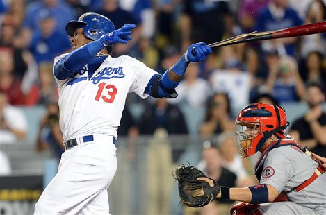 October 14, 2013; Los Angeles, CA, USA; Los Angeles Dodgers shortstop Hanley Ramirez (13) hits an RBI single in the eighth inning against th October 14, 2013; Los Angeles, CA, USA; Los Angeles Dodgers shortstop Hanley Ramirez (13) hits an RBI single in the eighth inning against th