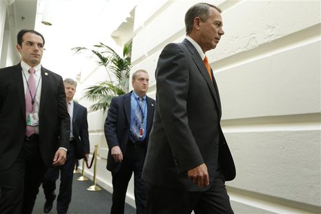 U.S. House Speaker John Boehner (R-OH) (R) arrives with his security detail for a House Republican caucus meeting at the U.S. Capitol in Was U.S. House Speaker John Boehner (R-OH) (R) arrives with his security detail for a House Republican caucus meeting at the U.S. Capitol in Was