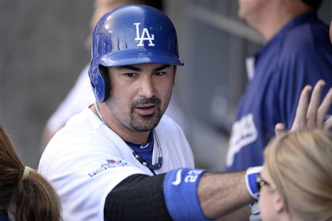 October 16, 2013; Los Angeles, CA, USA; Los Angeles Dodgers first baseman Adrian Gonzalez (23) reacts after hitting a solo home run in the e October 16, 2013; Los Angeles, CA, USA; Los Angeles Dodgers first baseman Adrian Gonzalez (23) reacts after hitting a solo home run in the e