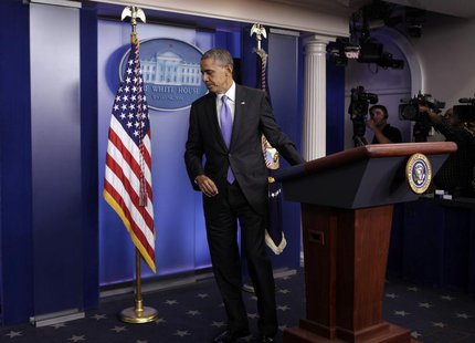 U.S. President Barack Obama leaves the briefing room of the White House in Washington after the Senate passed the bill to reopen the governm U.S. President Barack Obama leaves the briefing room of the White House in Washington after the Senate passed the bill to reopen the governm