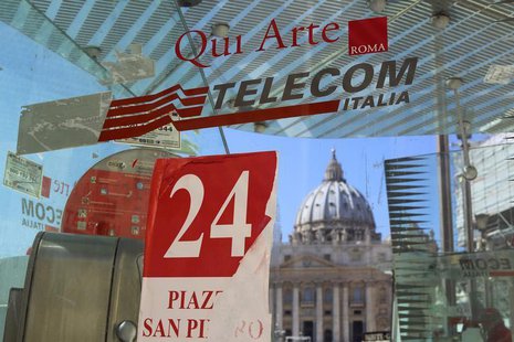 A Telecom Italia phone booth is pictured in front of St Peter's Basilica in Rome September 24, 2013. REUTERS/Alessandro Bianchi A Telecom Italia phone booth is pictured in front of St Peter's Basilica in Rome September 24, 2013. REUTERS/Alessandro Bianchi
