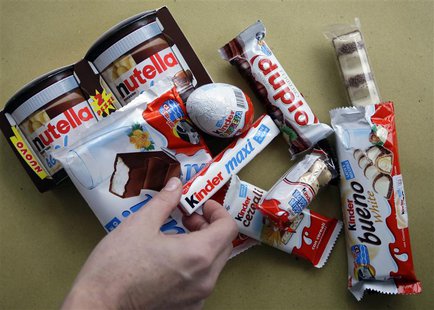 A woman takes a Kinder Ferrero chocolate in Milan November 20, 2009. REUTERS/Stefano Rellandini A woman takes a Kinder Ferrero chocolate in Milan November 20, 2009. REUTERS/Stefano Rellandini