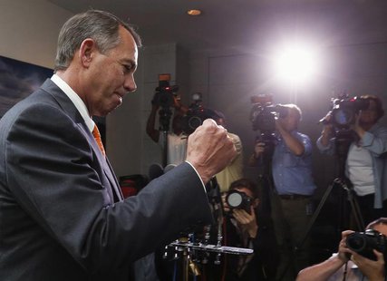 Speaker of the House John Boehner pumps his fist as he emerges from a meeting with Republican House members in the U.S. Capitol in Washingto Speaker of the House John Boehner pumps his fist as he emerges from a meeting with Republican House members in the U.S. Capitol in Washingto