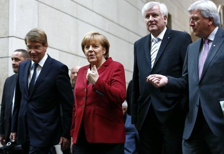 German Chancellor and leader of the Christian Democratic Union (CDU) Angela Merkel and party members arrive for preliminary coalition talks German Chancellor and leader of the Christian Democratic Union (CDU) Angela Merkel and party members arrive for preliminary coalition talks