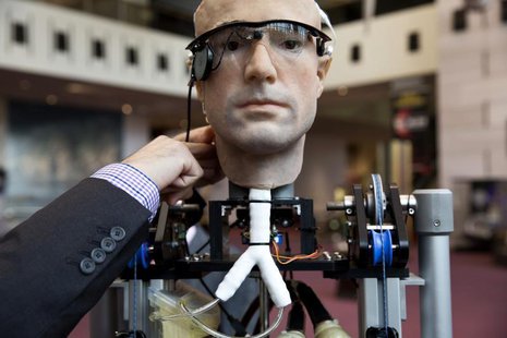 An engineer makes an adjustment to the robot "The Incredible Bionic Man" at the Smithsonian National Air and Space Museum in Washington Octo An engineer makes an adjustment to the robot "The Incredible Bionic Man" at the Smithsonian National Air and Space Museum in Washington Octo