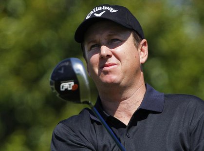 U.S. golfer J.J. Henry watches his drive of the 16th tee during second round play of the Quail Hollow Championship PGA golf tournament at Qu U.S. golfer J.J. Henry watches his drive of the 16th tee during second round play of the Quail Hollow Championship PGA golf tournament at Qu