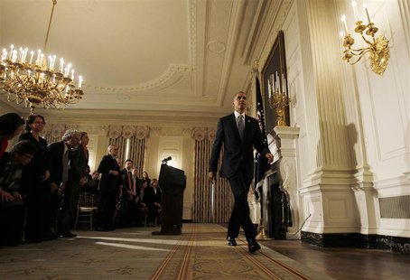 U.S. President Barack Obama departs the White House State Dining Room after delivering remarks on the end of the U.S. government shutdown in U.S. President Barack Obama departs the White House State Dining Room after delivering remarks on the end of the U.S. government shutdown in