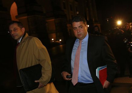 Leader of of Germany's Social Democratic Party (SPD) Sigmar Gabriel (R) leaves after preliminary coalition talks with Germany's conservative Leader of of Germany's Social Democratic Party (SPD) Sigmar Gabriel (R) leaves after preliminary coalition talks with Germany's conservative