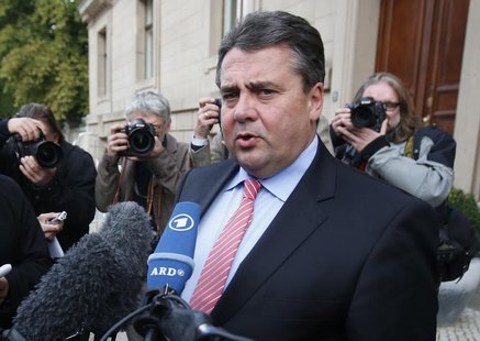 Social Democratic Party (SPD) party leader Sigmar Gabriel addresses the media after preliminary coalition talks between Germany's conservati Social Democratic Party (SPD) party leader Sigmar Gabriel addresses the media after preliminary coalition talks between Germany's conservati