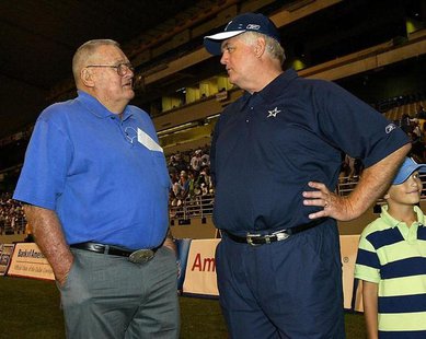 Dallas Cowboys' new head coach Wade Phillips (R) talks to his father, former head coach of the Houston Oilers, Bum Phillips on the opening d Dallas Cowboys' new head coach Wade Phillips (R) talks to his father, former head coach of the Houston Oilers, Bum Phillips on the opening d