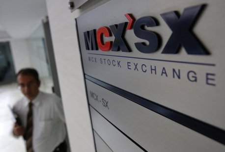 A staff member walks past the MCX-SX logo at their Exchange Square building in Mumbai February 11, 2013. REUTERS/Vivek Prakash A staff member walks past the MCX-SX logo at their Exchange Square building in Mumbai February 11, 2013. REUTERS/Vivek Prakash