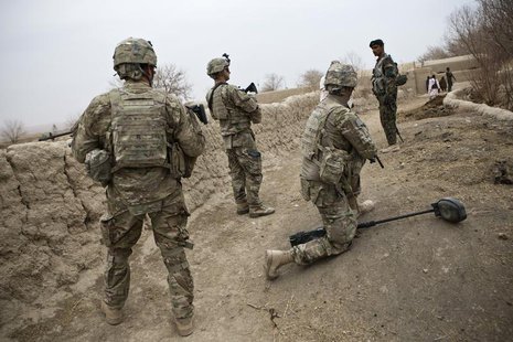 U.S. troops are seen on patrol near Command Outpost AJK (short for Azim-Jan-Kariz, a nearby village) in Maiwand District, Kandahar Province, U.S. troops are seen on patrol near Command Outpost AJK (short for Azim-Jan-Kariz, a nearby village) in Maiwand District, Kandahar Province,
