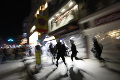 Riot police chase demonstrators during an anti-government protest in Istanbul's Kadikoy district late September 15, 2013. REUTERS/Murad Seze Riot police chase demonstrators during an anti-government protest in Istanbul's Kadikoy district late September 15, 2013. REUTERS/Murad Seze
