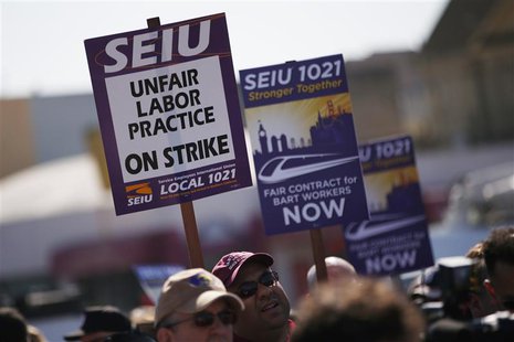 Demonstrators hold signs in support of striking Bay Area Rapid Transit (BART) workers outside Lake Merritt Station in Oakland, California Oc Demonstrators hold signs in support of striking Bay Area Rapid Transit (BART) workers outside Lake Merritt Station in Oakland, California Oc