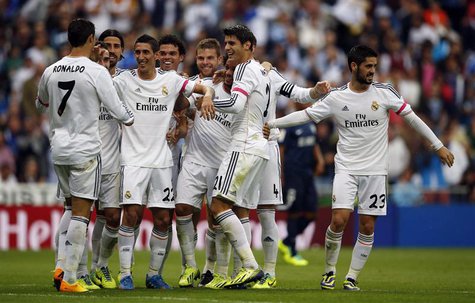 Real Madrid's Angel Di Maria (4th L) celebrates with teammates after scoring a goal during their Spanish first division soccer match against Real Madrid's Angel Di Maria (4th L) celebrates with teammates after scoring a goal during their Spanish first division soccer match against