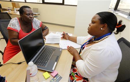 Certified Application Counselor Sheslie Caze (R) takes information from a woman who asked not to be identified as she inquired about the Affordable Care Act insurance, commonly referred to as Obamacare, at the Borinquen Medical Center in Miami, Florida October 1, 2013.
REUTERS/Joe Skipper Certified Application Counselor Sheslie Caze (R) takes information from a woman who asked not to be identified as she inquired about the Affordable Care Act insurance, commonly referred to as Obamacare, at the Borinquen Medical Center in Miami, Florida October 1, 2013.
REUTERS/Joe Skipper