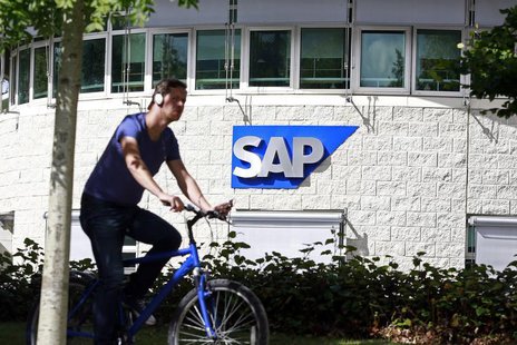 A man cycles past the SAP logo at its offices in the CityWest complex, Dublin September 5, 2013. REUTERS/Cathal McNaughton A man cycles past the SAP logo at its offices in the CityWest complex, Dublin September 5, 2013. REUTERS/Cathal McNaughton