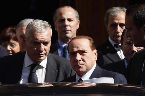 Italian center-right leader Silvio Berlusconi sits in hi car as he leaves the Senate in Rome, October 2, 2013. REUTERS/Remo Casilli Italian center-right leader Silvio Berlusconi sits in hi car as he leaves the Senate in Rome, October 2, 2013. REUTERS/Remo Casilli